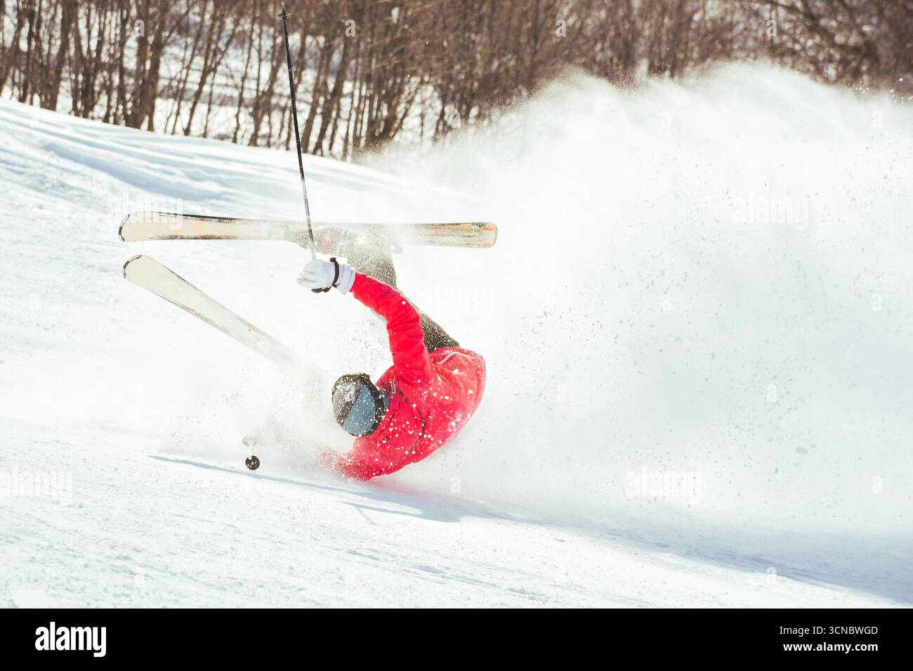 Skier fall down hit head painfully on hard groomed piste with snow ...