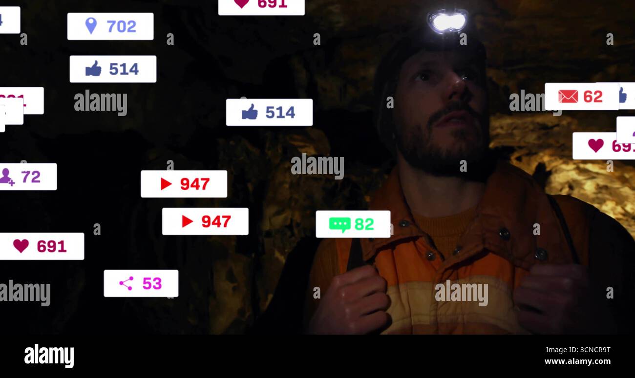 Exploring man wearing orange jacket navigating cave with helmet ...