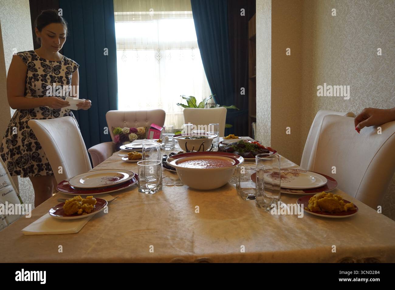 Woman Preparing Table Dinner Concept,toned Stock Photo