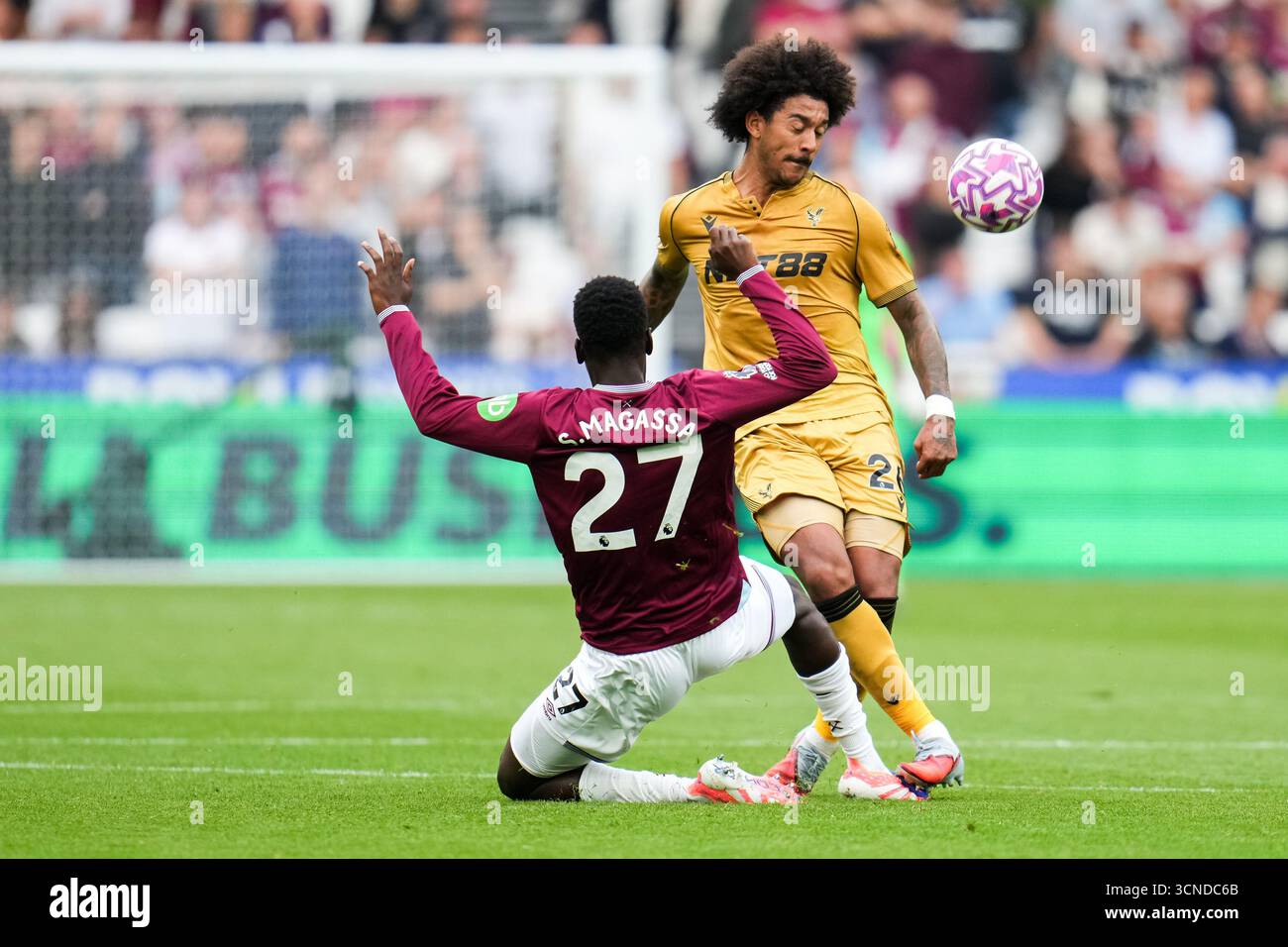 Soungoutou Magassa of West Ham United tries to win the ball off Chris ...