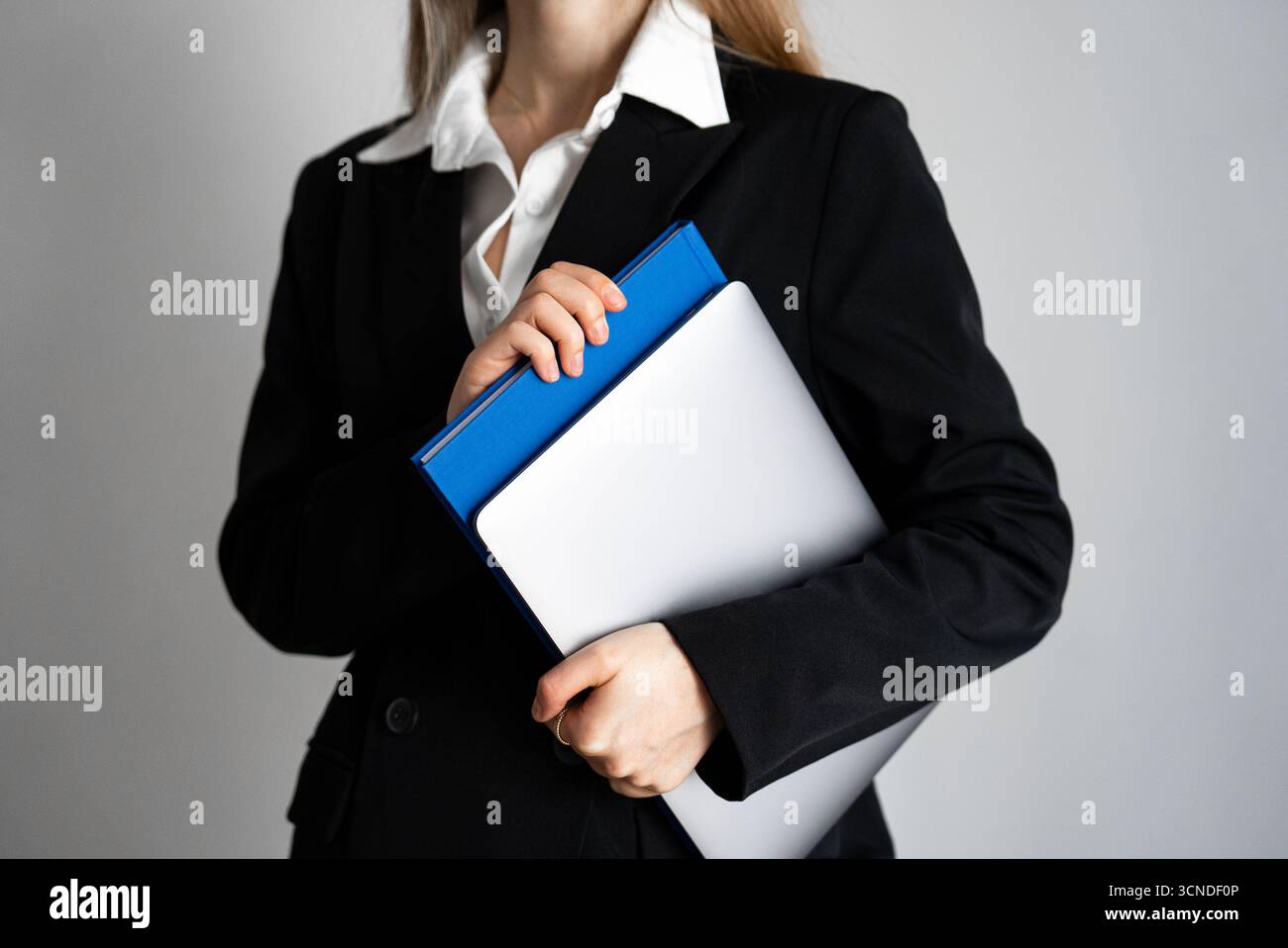 Businesswoman in black blazer hi-res stock photography and images - Alamy