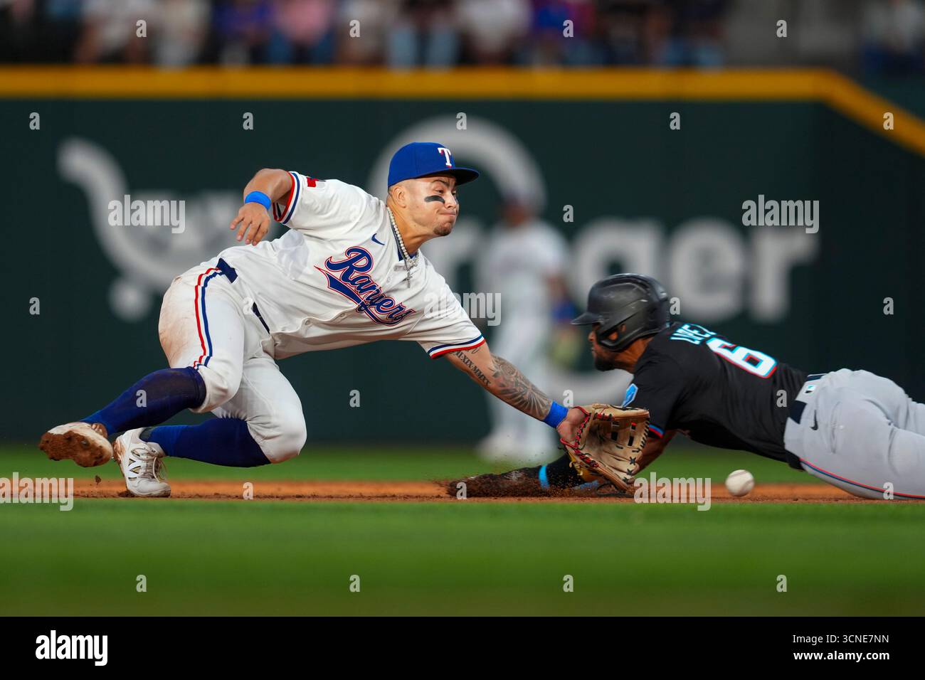 Cody Freeman Rangers Texas Rangers second baseman Cody Freeman, left, reaches for a throw as ...