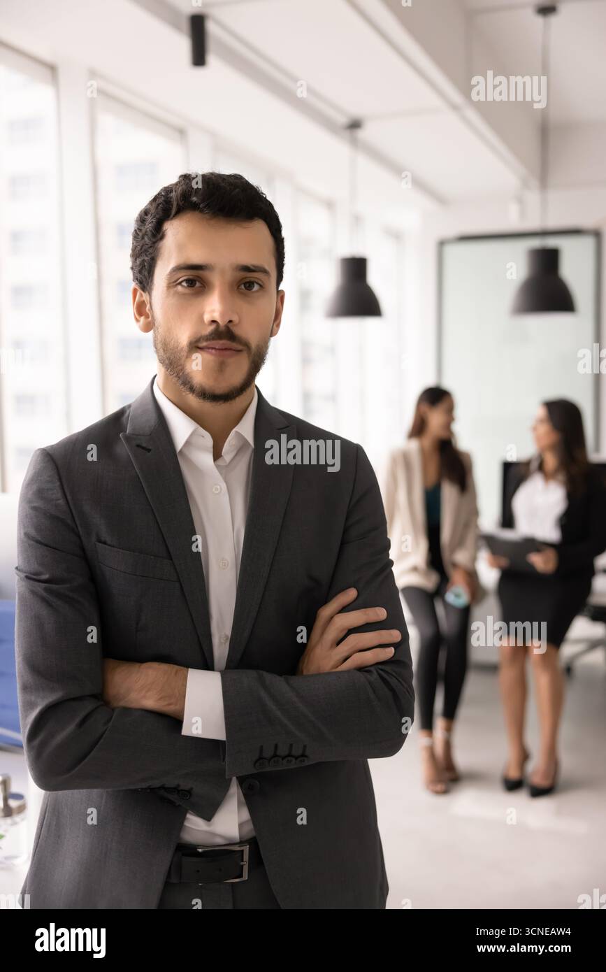 Confident young Middle Eastern professional man standing for portrait Stock Photo
