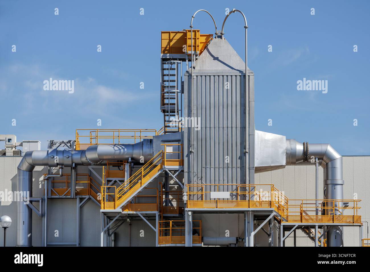 Housing of towering rectangular filter system dominates industrial ...