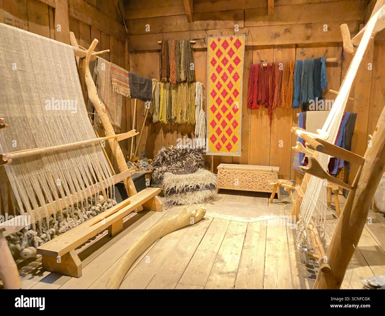 A Viking weaving workshop inside the Viking ChieftainÕs longhouse, the largest Viking house ever discovered!  It is 83 metres long and 9.5 metres wide - Smartphone Captured Stock Image
