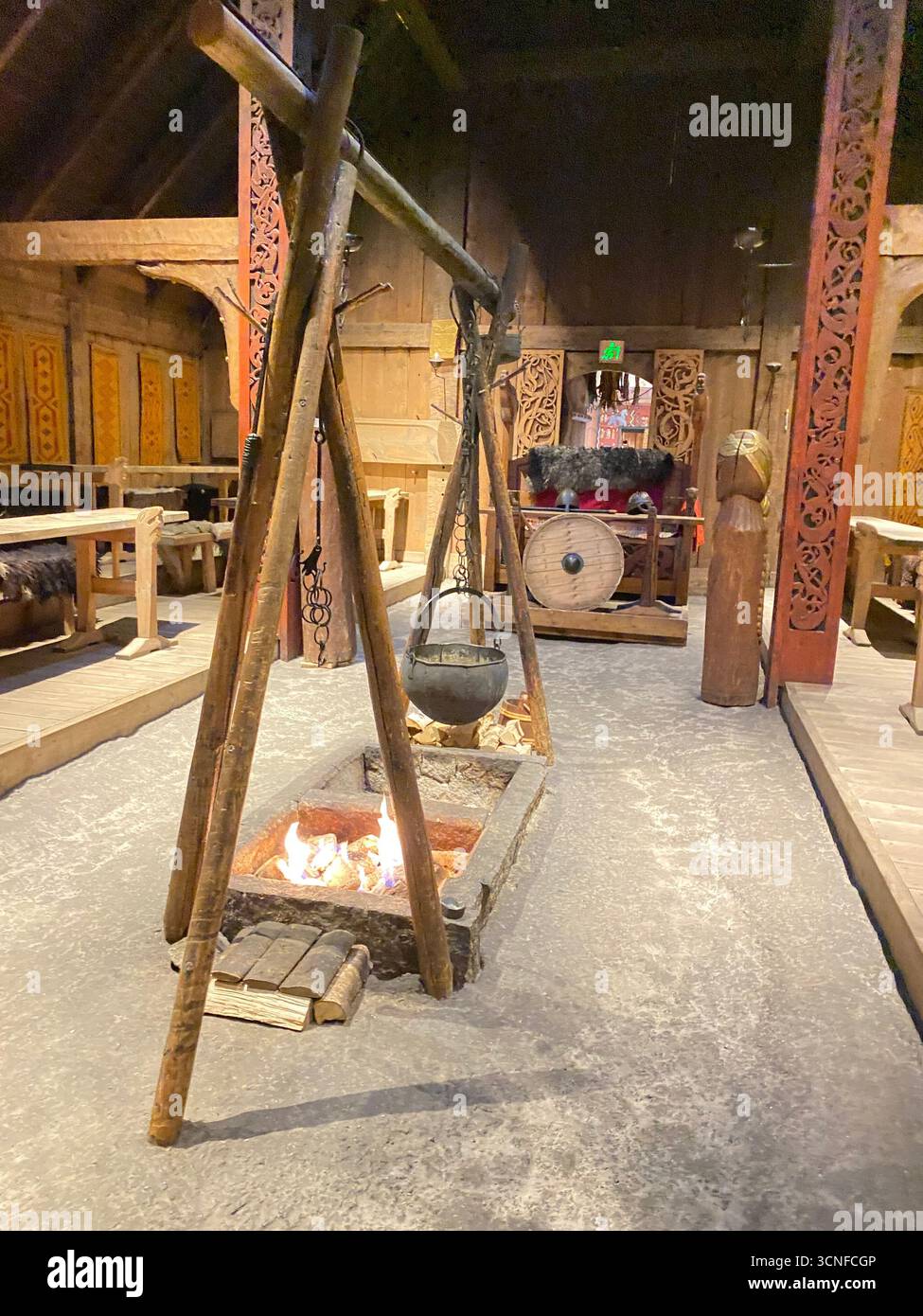 The Viking main dining area with a traditional cooking utensils inside the Viking ChieftainÕs longhouse, the largest Viking house ever discovered!  It - Smartphone Captured Stock Image