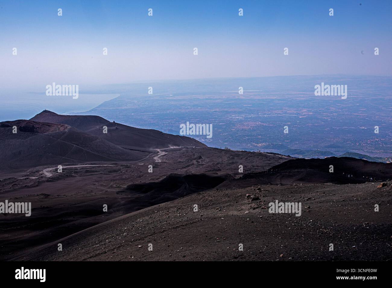 view of the crater on Mount Etna and Sicily during the day. Traveling ...