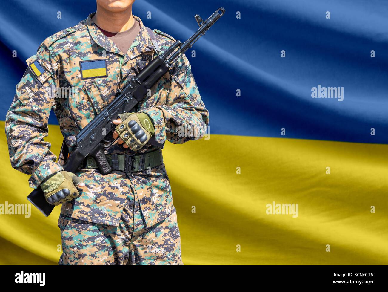 Ukraine flag with soldier in military uniform holding assault rifle in ...