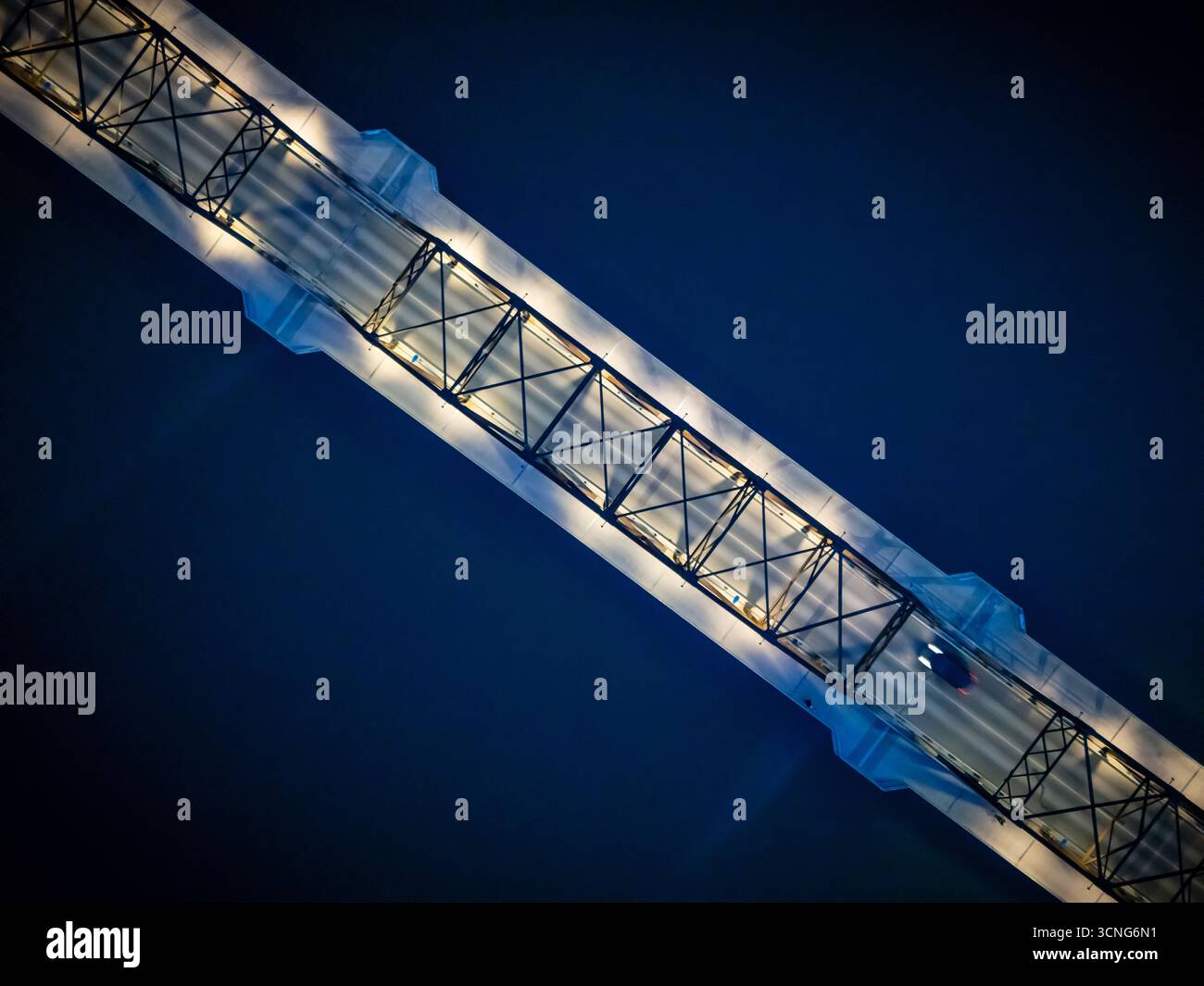 Aerial night view of the Traffic Bridge in Saskatoon, Saskatchewan, with city lights reflecting on the South Saskatchewan River. Stock Photo