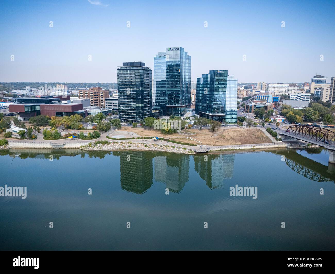 Aerial daytime view of downtown Saskatoon, Saskatchewan, featuring the city skyline, river, and bridges. Stock Photo