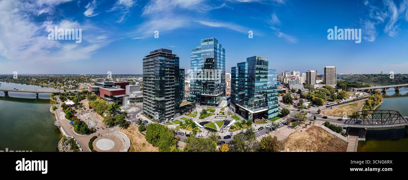 Aerial daytime view of downtown Saskatoon, Saskatchewan, featuring the city skyline, river, and bridges. Stock Photo