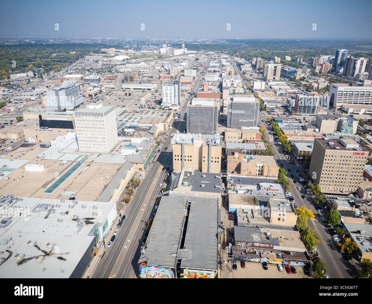 Aerial daytime view of downtown Saskatoon, Saskatchewan, featuring the city skyline, river, and bridges. Stock Photo