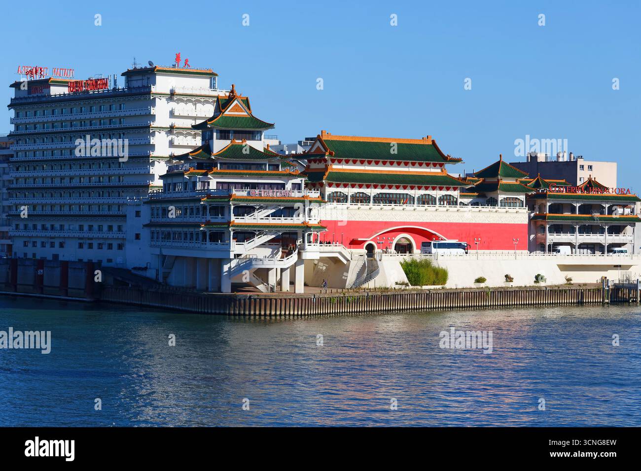 The view of the chinese-inspired architecture of the Huatian Chinagora complex with curved roof corners and traditional glazed roof tiles. Stock Photo