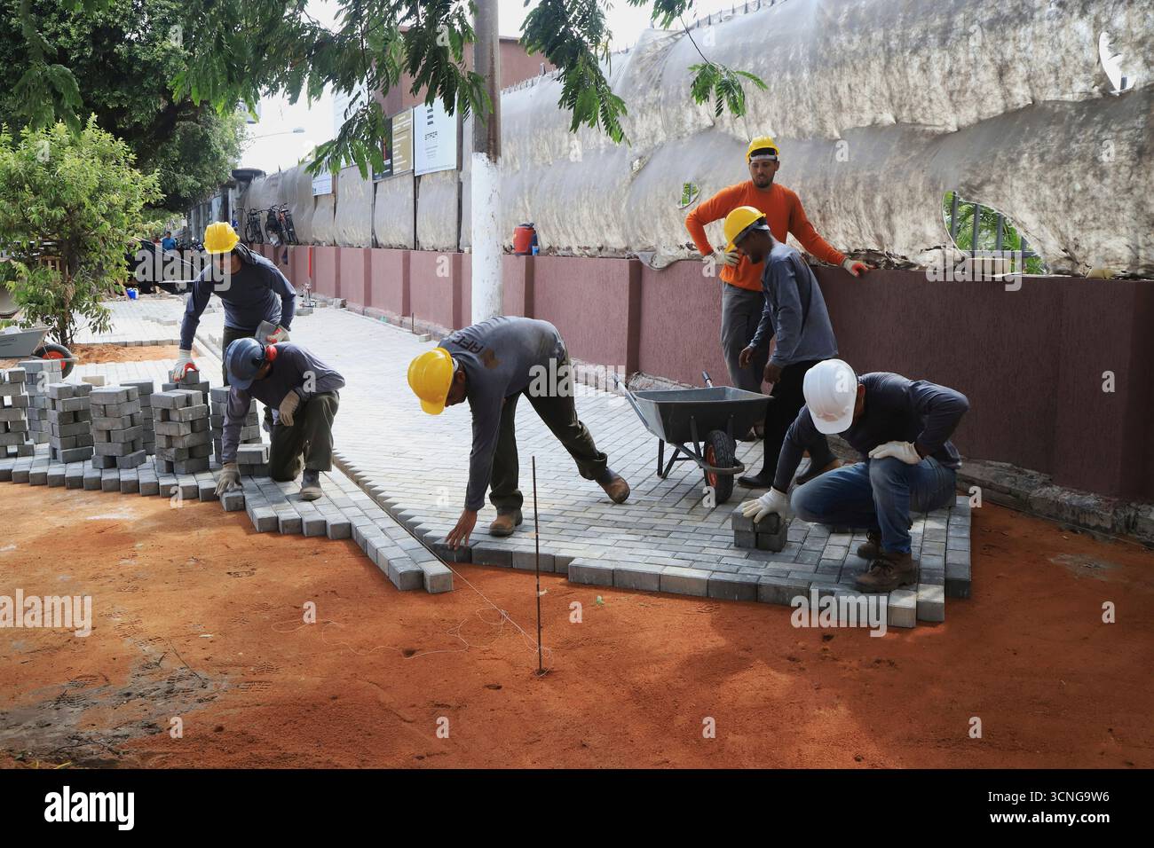 workers-prepare-a-sidewalk-on-the-banks-of-the-guajara-bay-as-part-of
