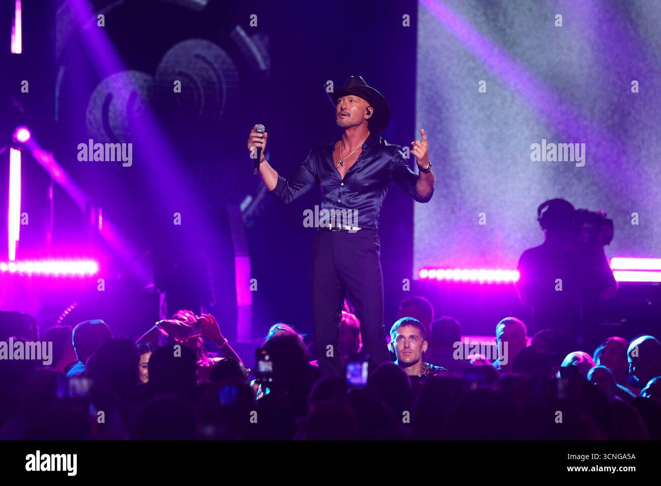 Tim McGraw performs on stage during the iHeartRadio Music Festival