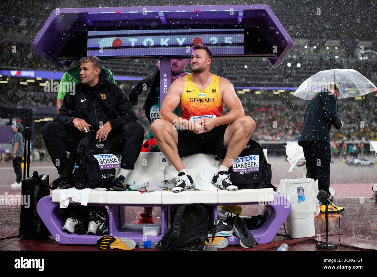 Germany's Mika Sosna and Henrik Janssen shelter from the rain during ...