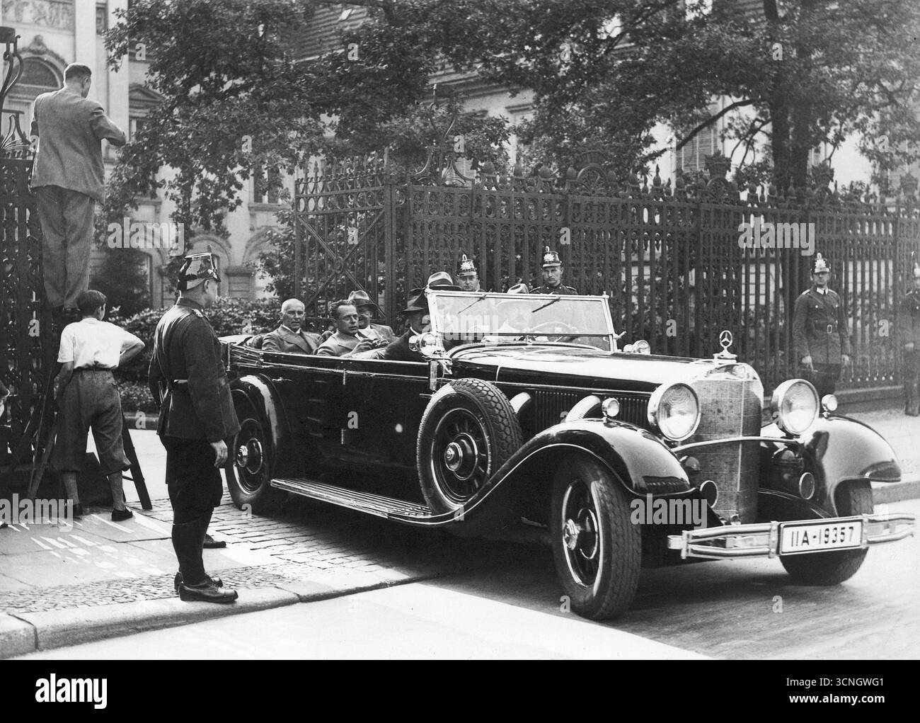 NSDAP leader Adolf Hitler in civilian clothes, leaving in a Mercedes, after meeting with President Paul von Hindenburg, 1932 Stock Photo