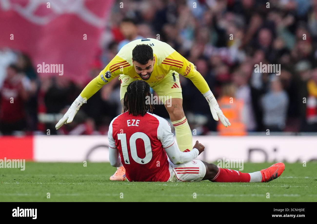Arsenal goalkeeper David Raya celebrates with teammate Eberechi Eze ...