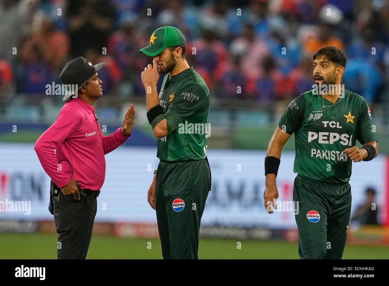 Umpire talks to Pakistani players during the Asia Cup cricket match ...