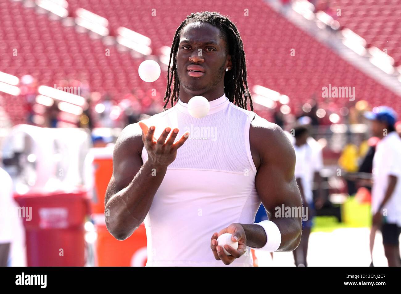 Arizona Cardinals wide receiver Marvin Harrison Jr. juggles as he warms
