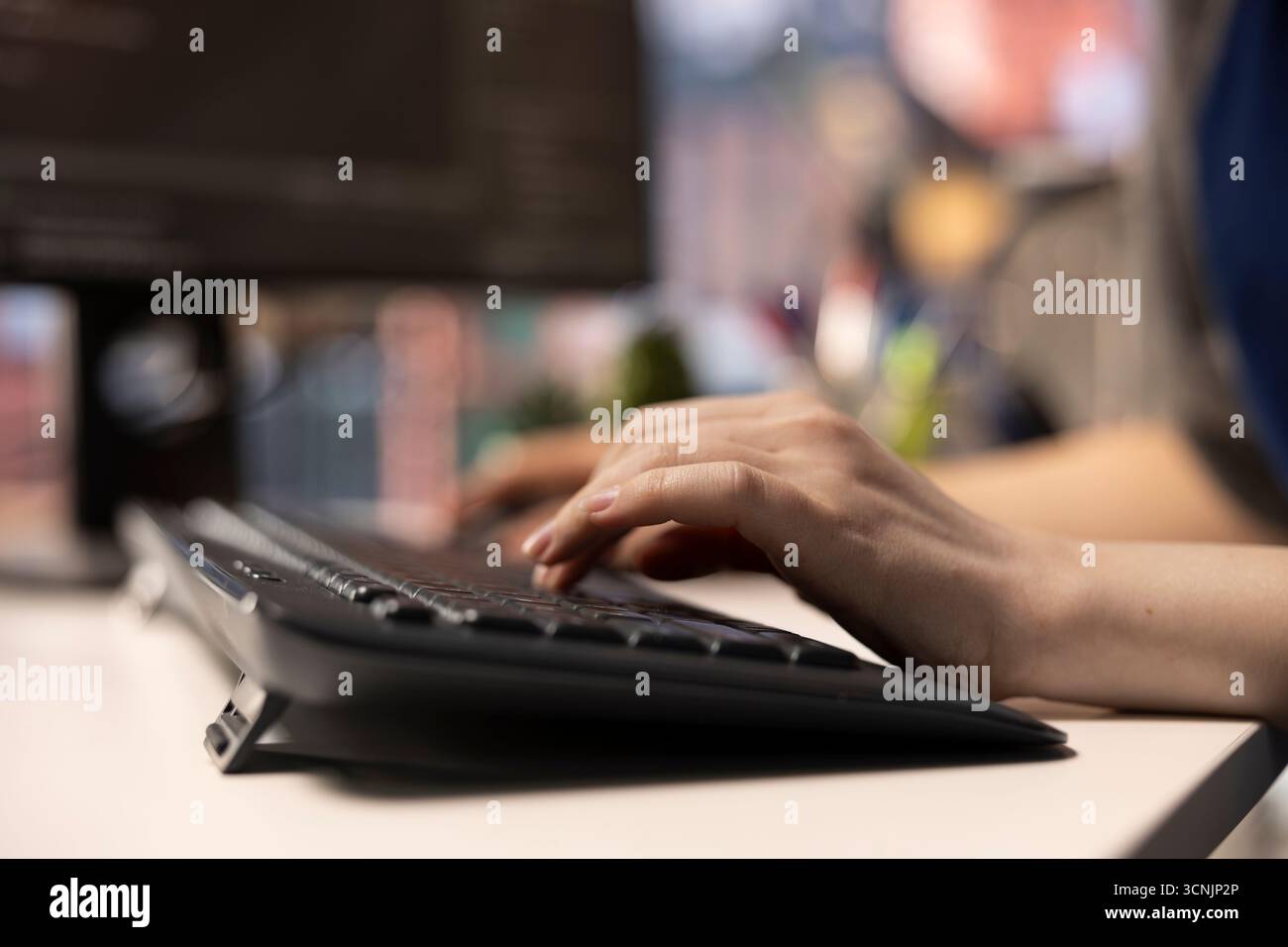 Software expert at workstation programming on pc and writing lines of code, using coding tools and a terminal window interface. Woman debugging software for web development. Close up. Stock Photo