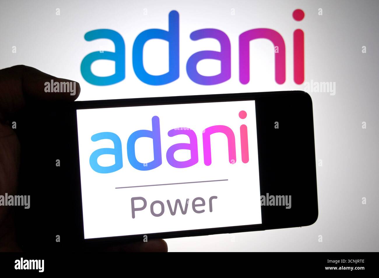 In this photo illustration, an Adani Power logo is seen displayed on a ...