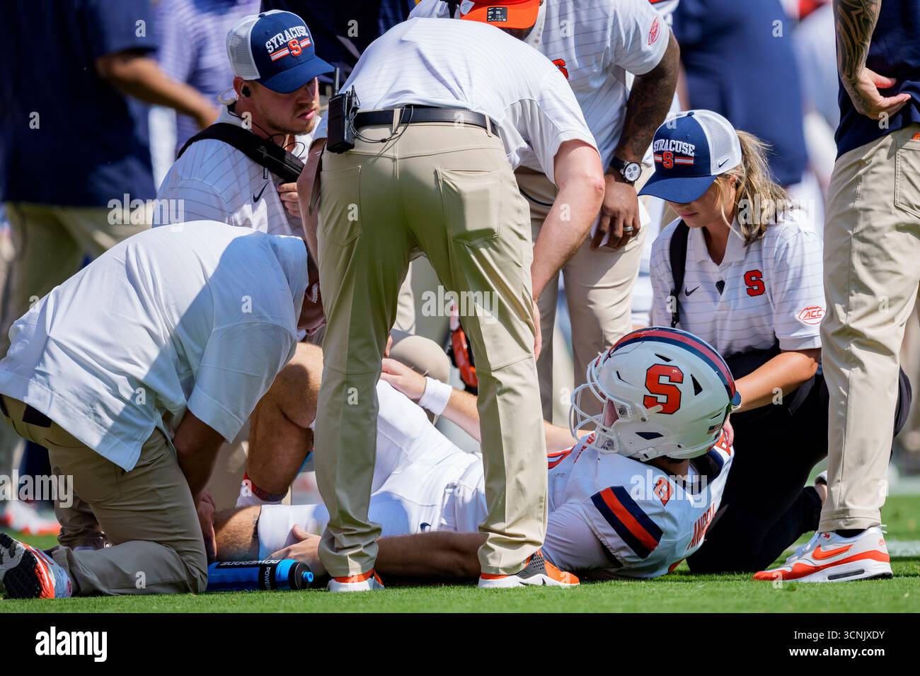 Syracuse quarterback Steve Angeli (9) is shaken up after a play against ...