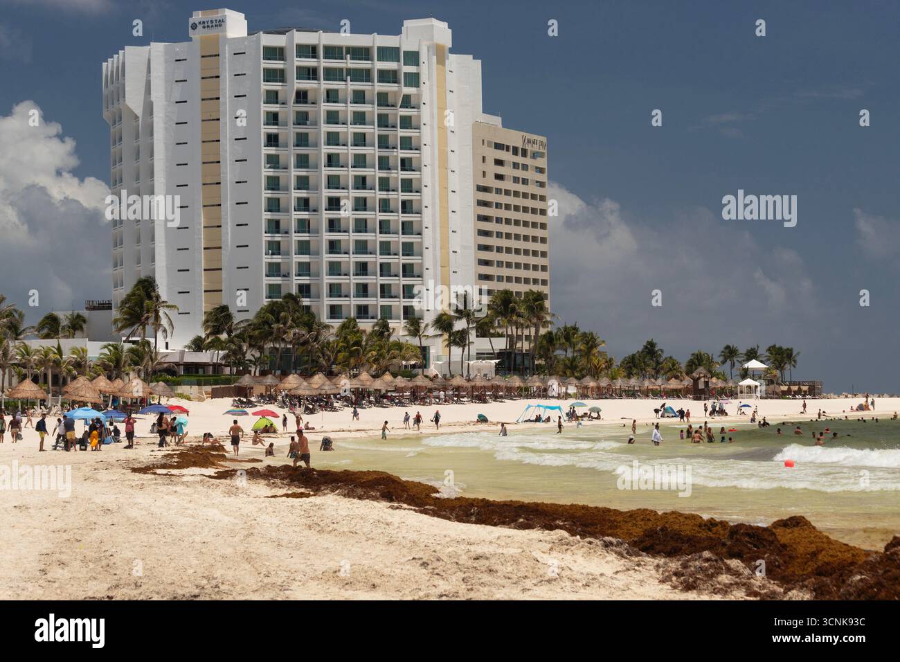 Beautiful beach scene of cancun mexico with a modern hotel building at  background in sunny day Stock Photo - Alamy