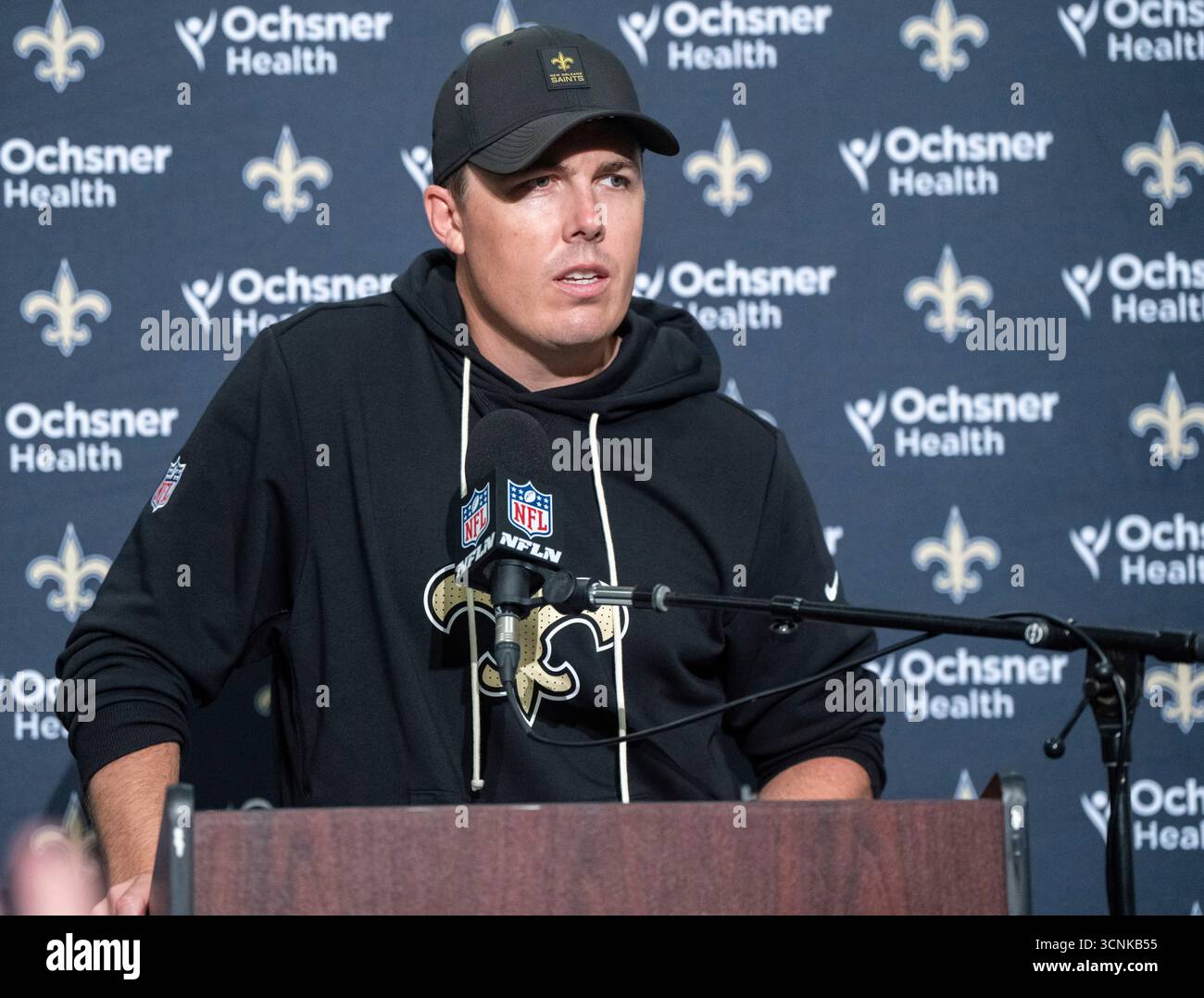 New Orleans Saints head coach Kellen Moore answers a reporter's ...