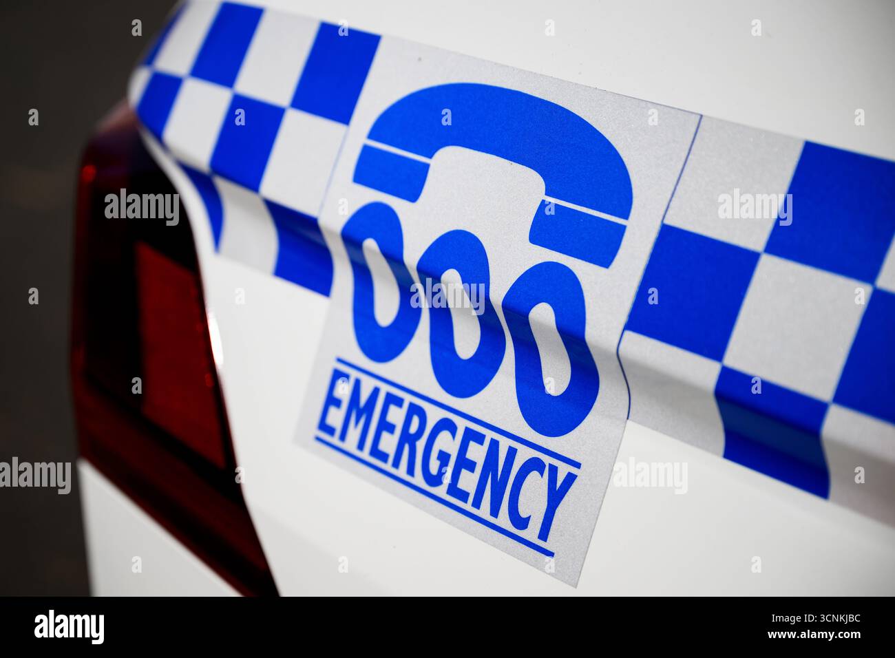 Signage for the Australian emergency call number Triple 000 is seen on ...