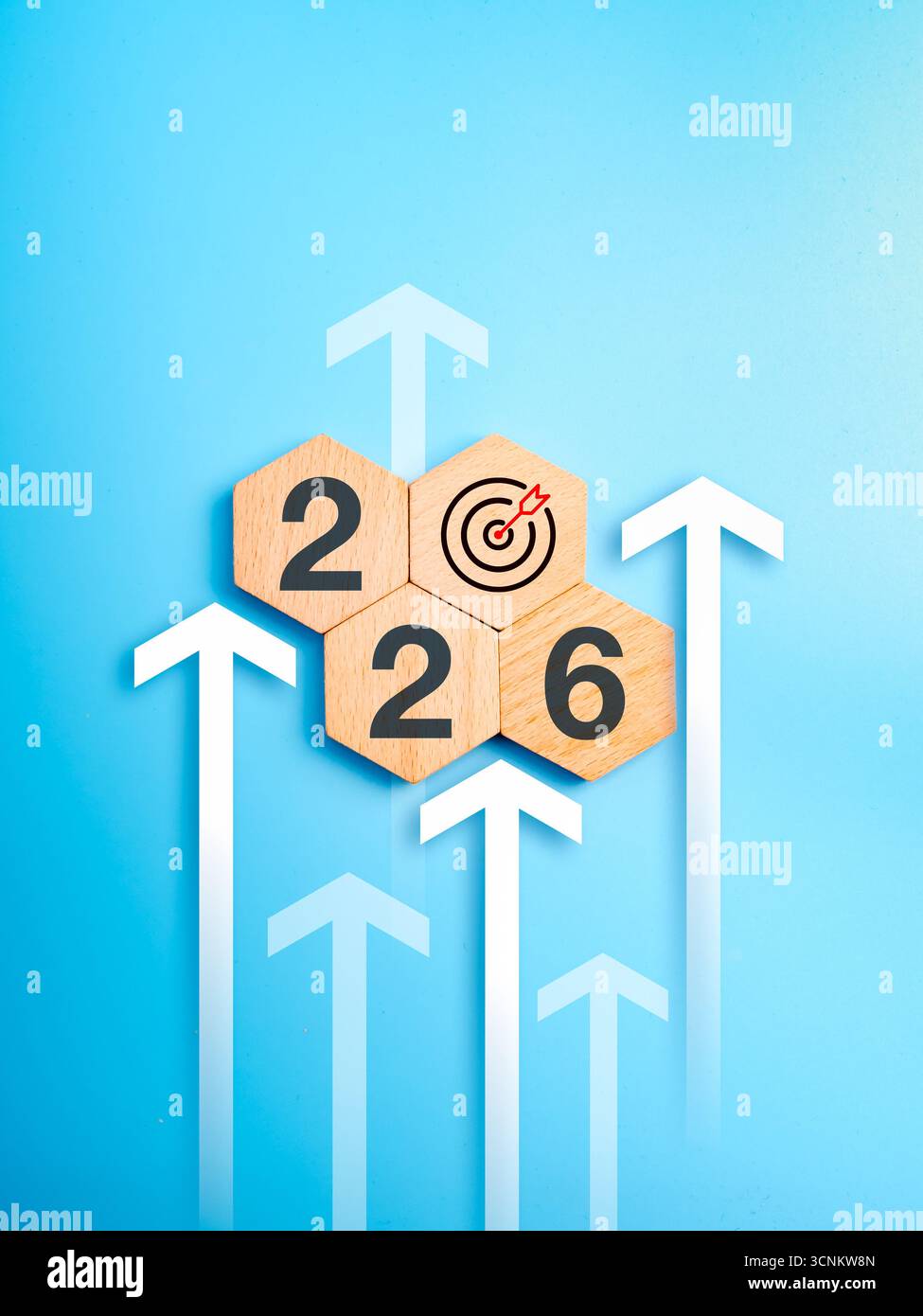 Wooden hexagon blocks showing 2026 and target icon with upward arrows ...