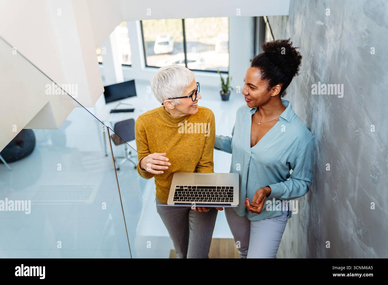 Mixed team of software engineers brainstorming ideas. Diverse app developers collaborating as group Stock Photo