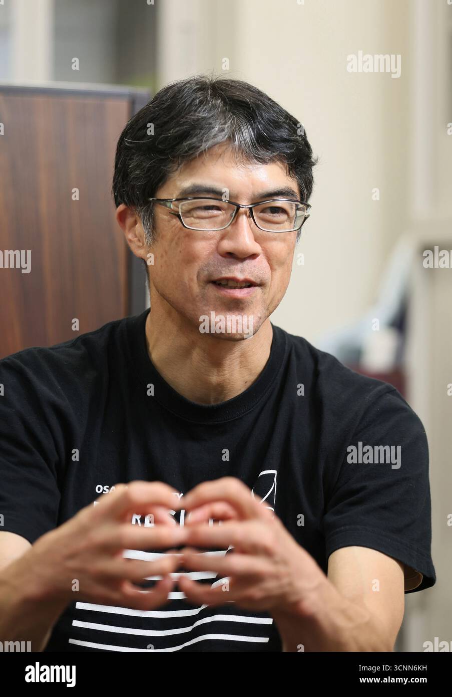 Professor Yusuke Mori of Osaka University answers questions in an ...