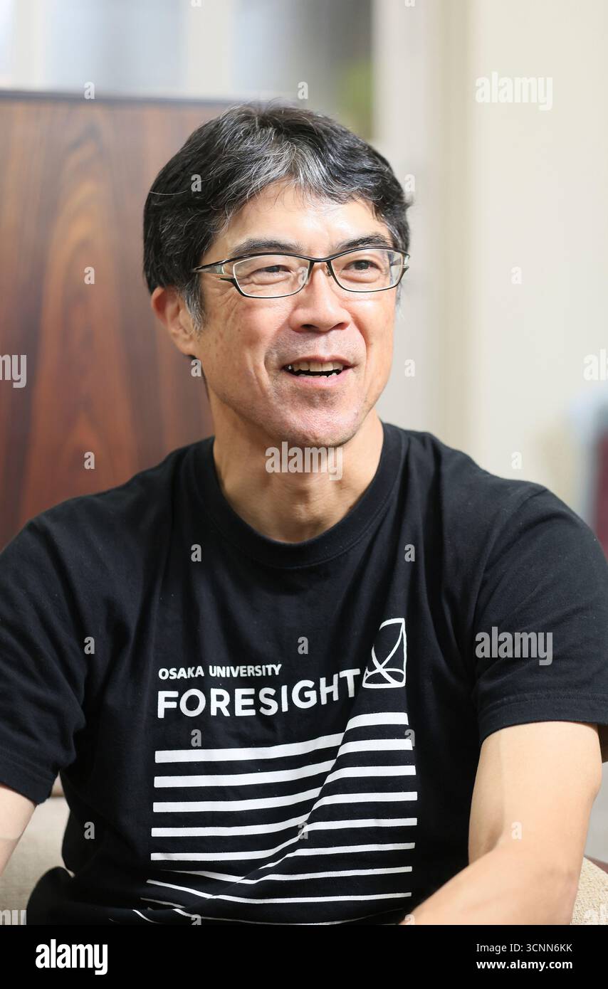 Professor Yusuke Mori of Osaka University answers questions in an ...