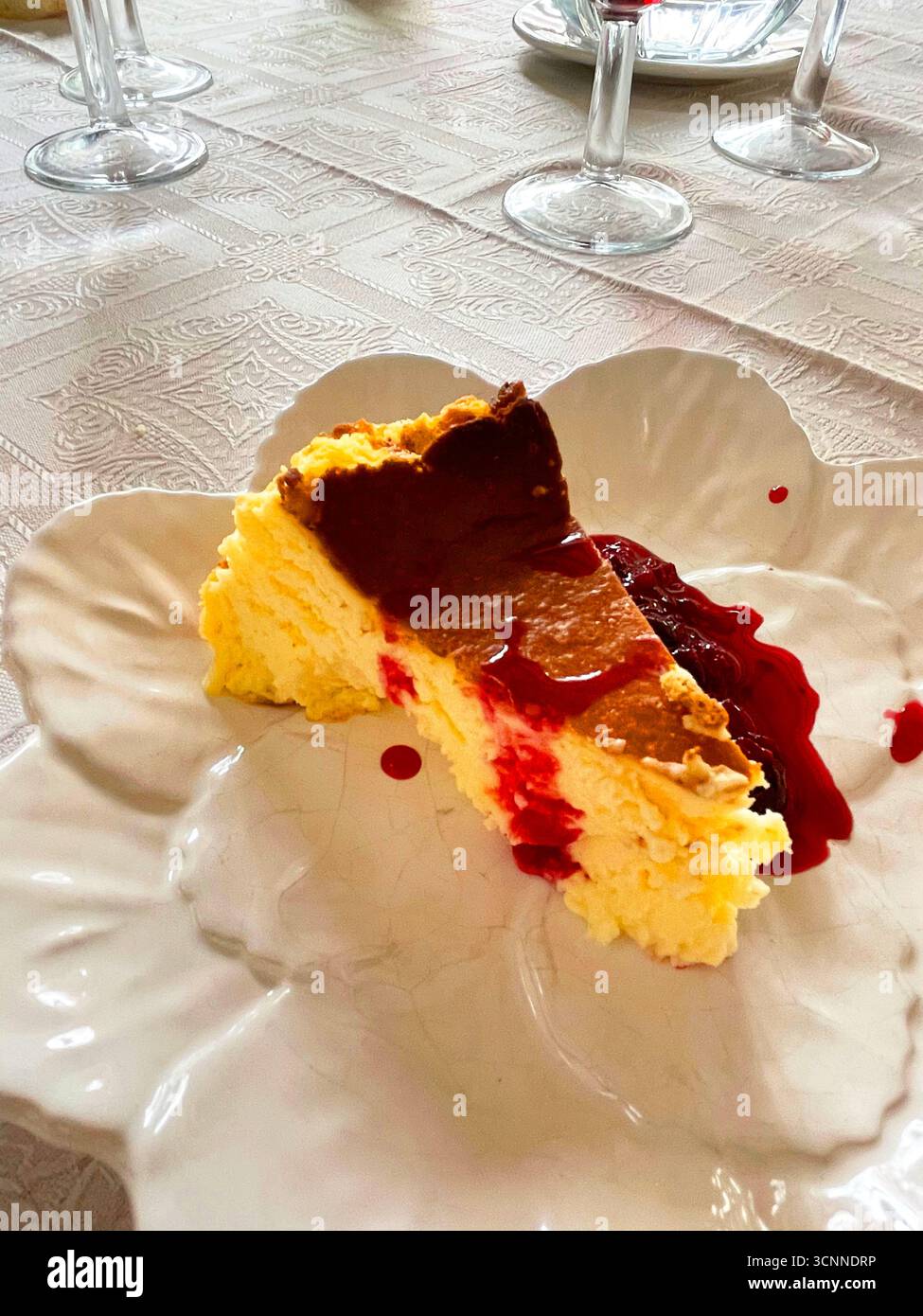 Cheese cake with raspberry jam. Spain. - Smartphone Captured Stock Image