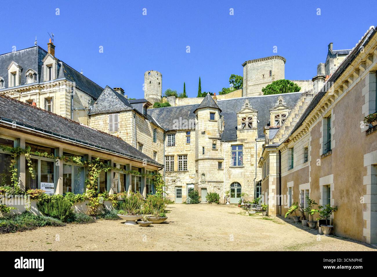 Courtyard of originally 13-14th century residences, later Hotel Bodard de la Jacopière, a Monument Historique in Chinon, Indre-et-Loire (37), France. Stock Photo