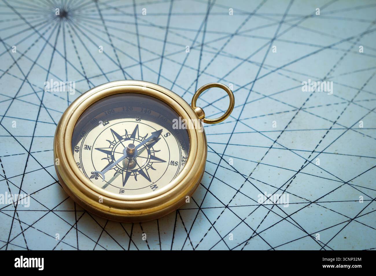 Old compass on vintage map Stock Photo