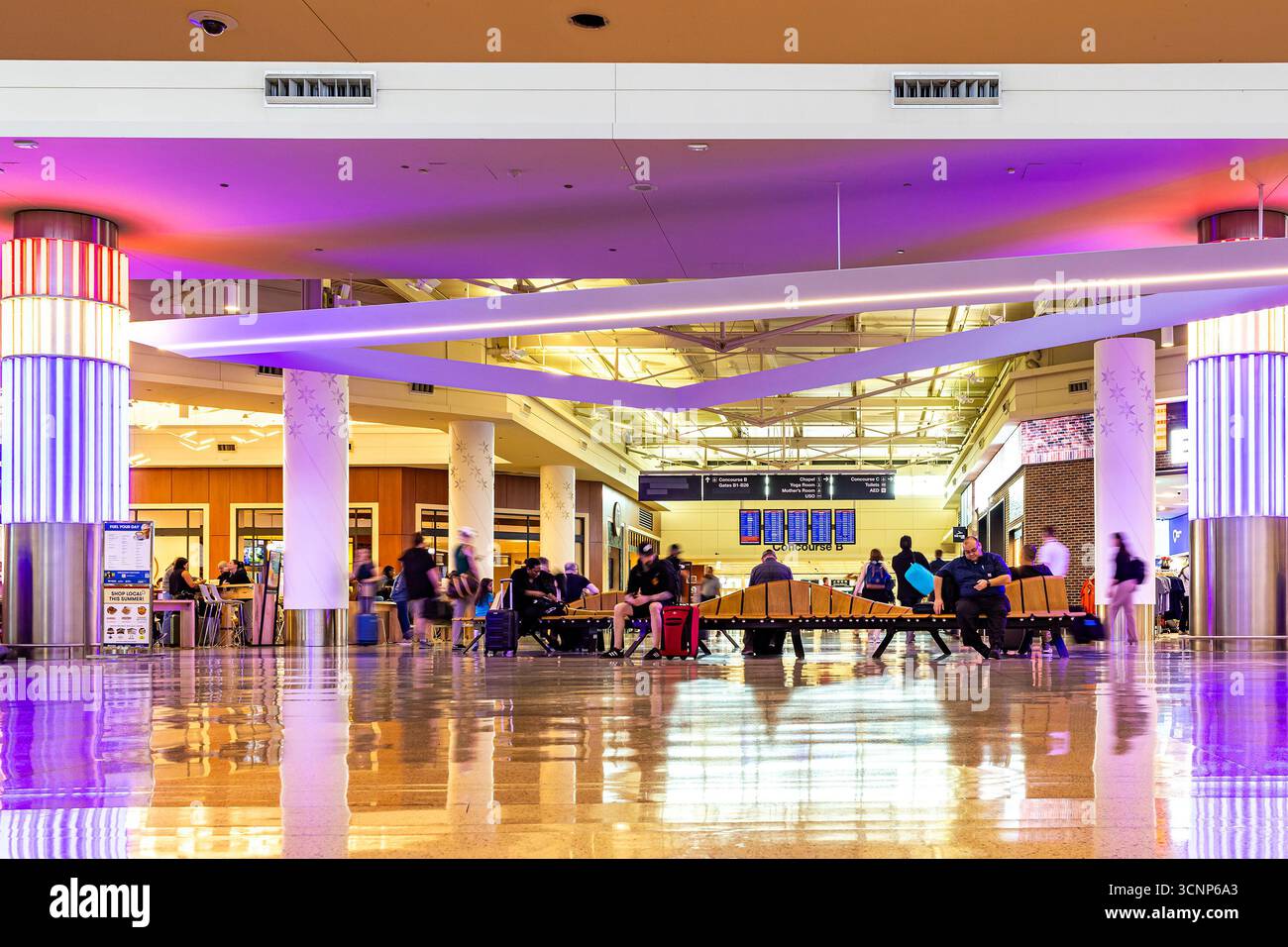 Passengers wait in the seating area in the concourse of Chicago Midway ...