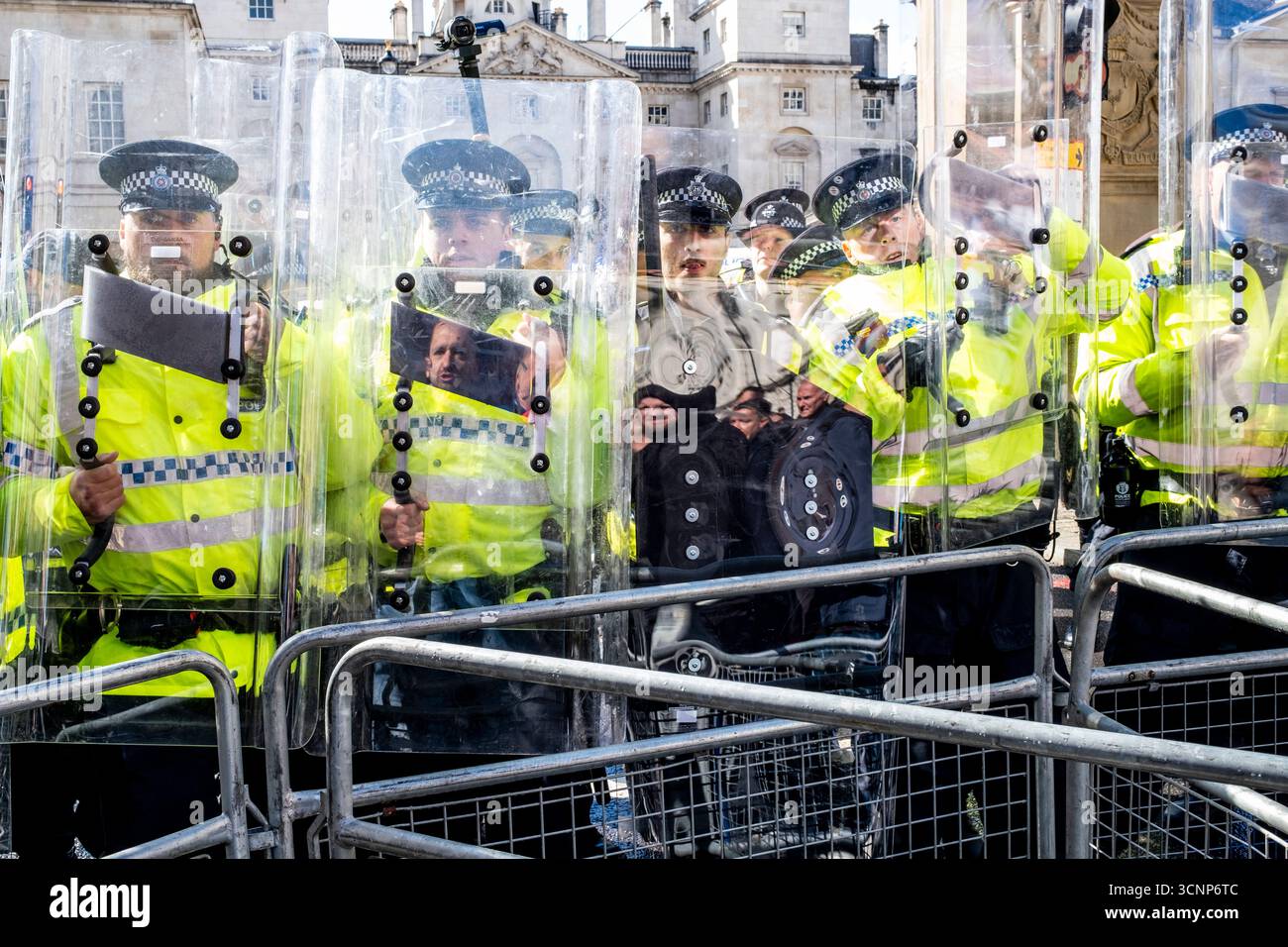 Met Police Officers Stand With Riot Shields Preventing People From ...