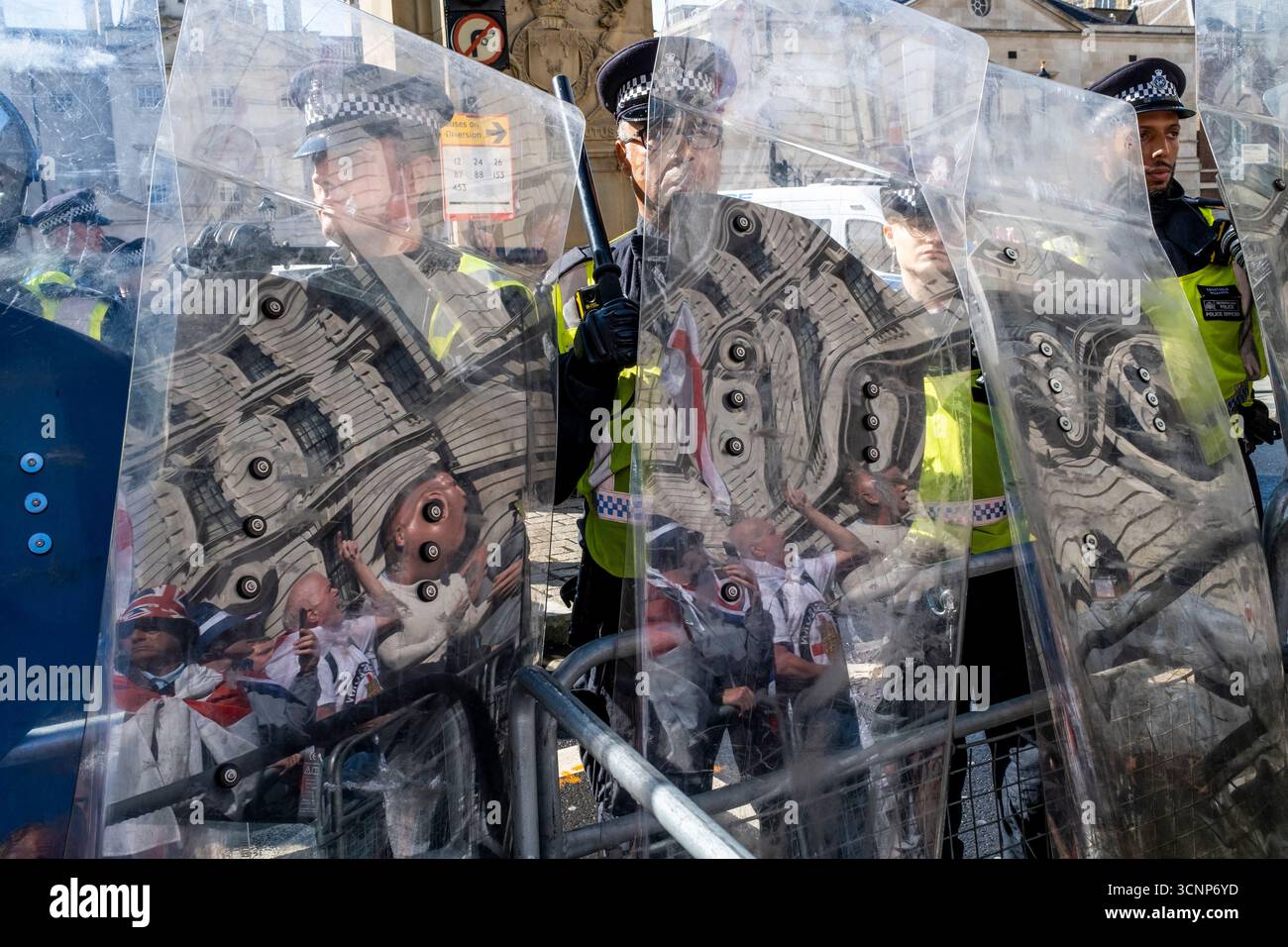 Metropolitan Police Officers Stand Behind Riot Shields Preventing ...