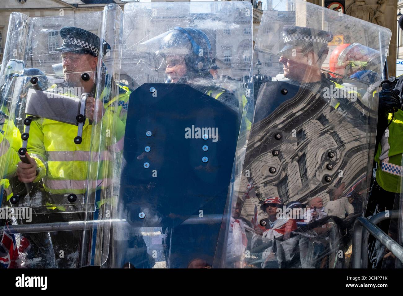 Metropolitan Police Officers Stand Behind Riot Shields Preventing ...