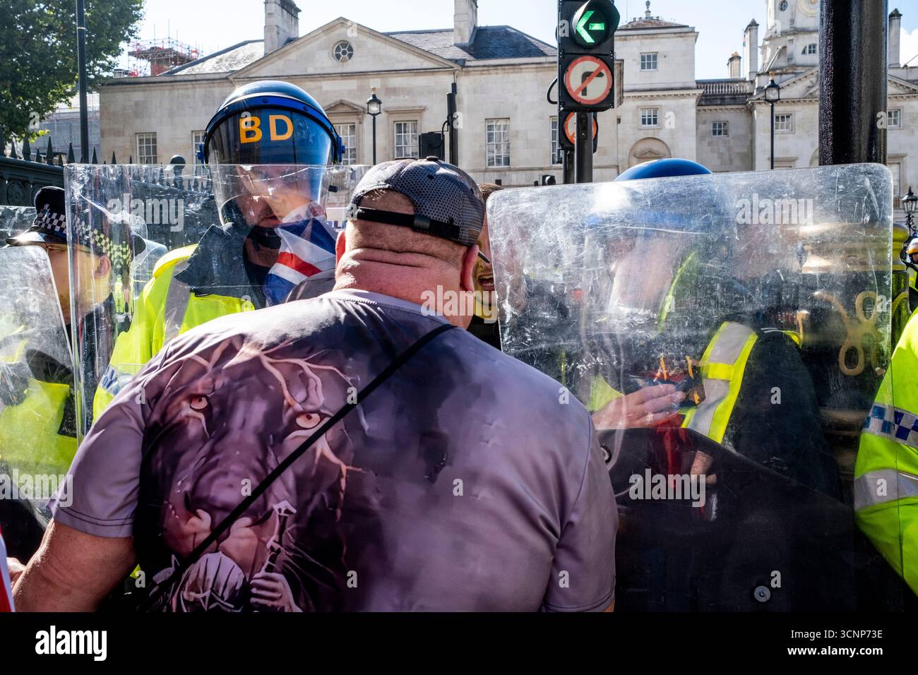 Metropolitan Police Officers Stand Behind Riot Shields Preventing ...