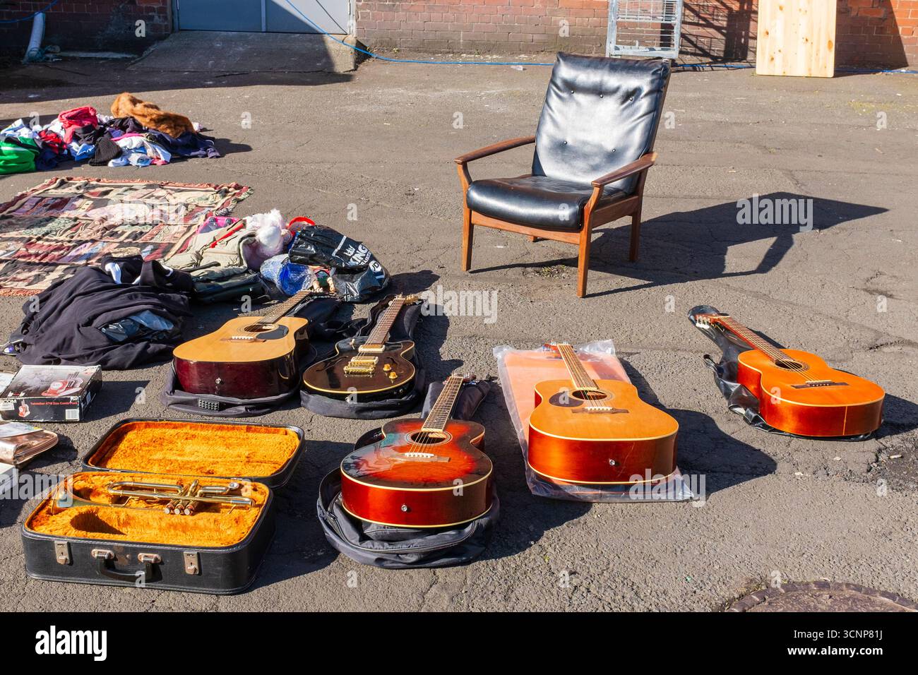 Selection of secondhand musical instruments for sale and on display at a street market, Ayr, Ayrshire, Scotland, UK Stock Photo