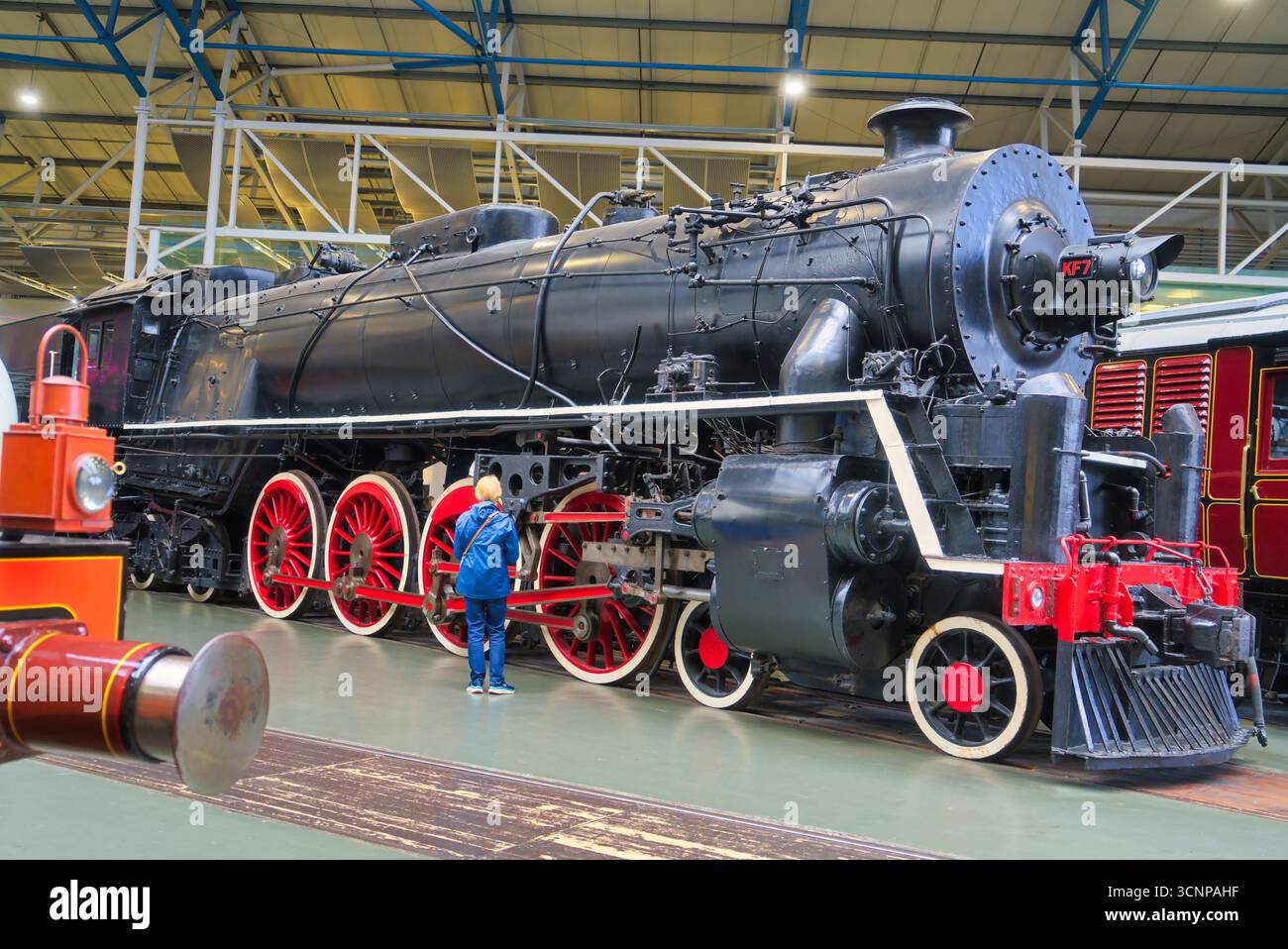 Woman admiring huge steam engine '4-8-4, number KF7, built by Britain ...