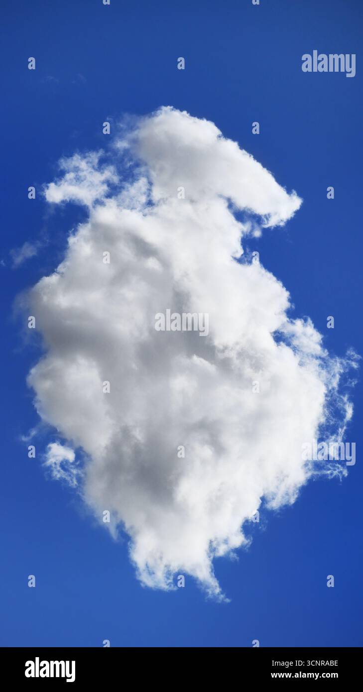 Single fluffy white cloud in blue sky Stock Photo