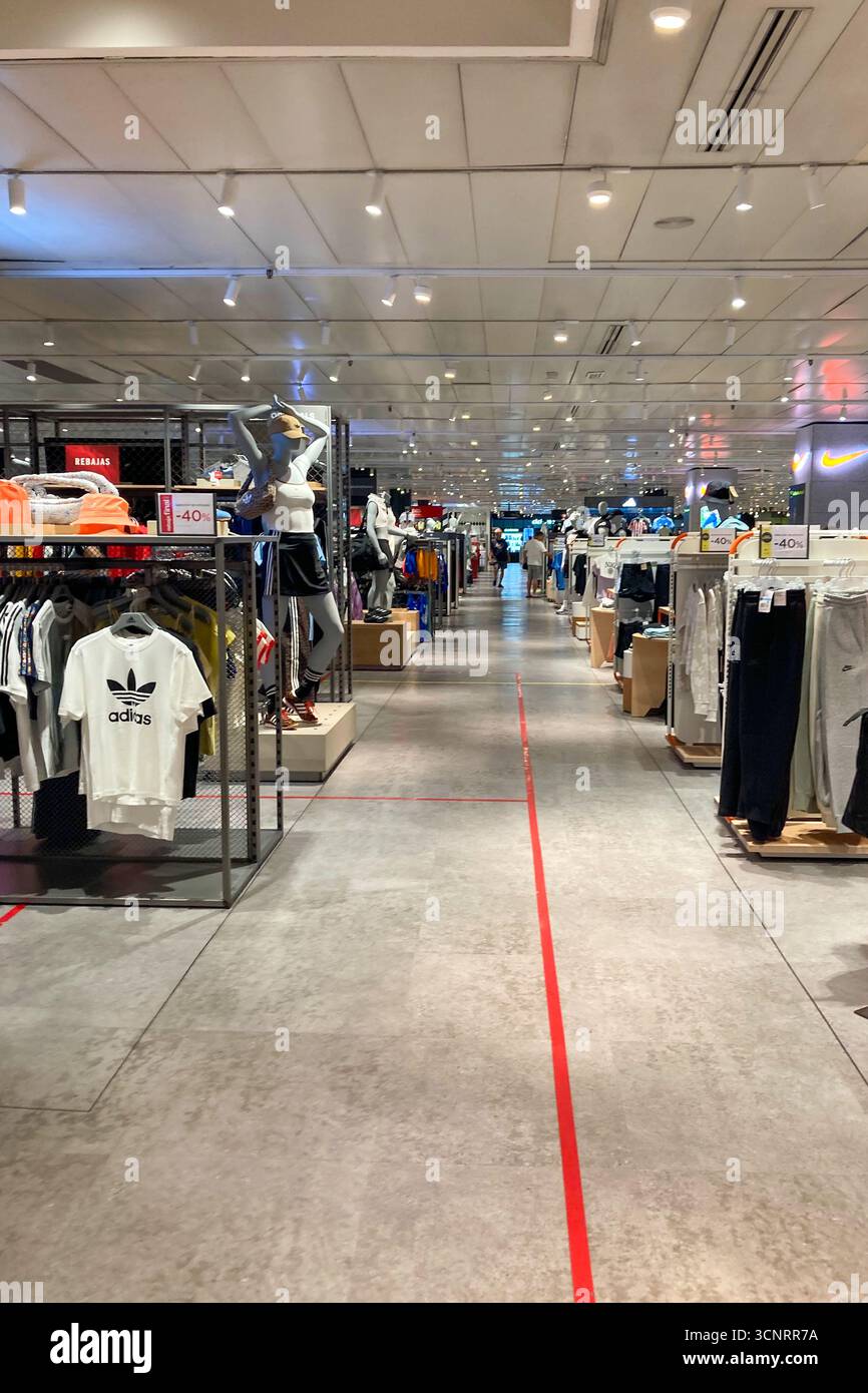 MALAGA, SPAIN - JULY 10, 2025: Shelves in El Corte Inglés supermarket in Malaga, Spain, are neatly stocked with a wide variety of food and beverages, - Smartphone Captured Stock Image