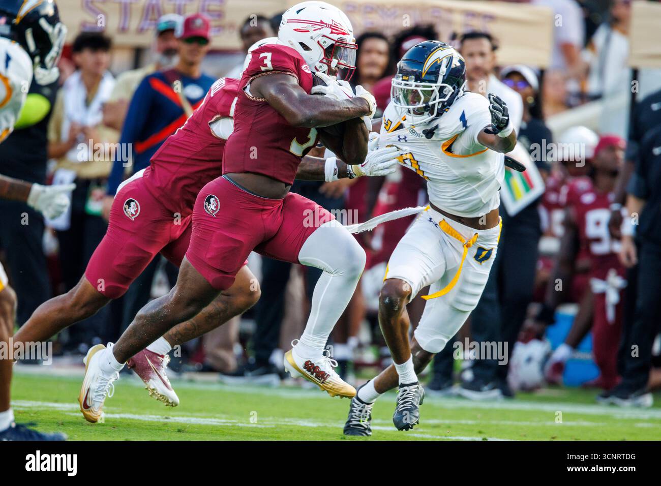 Florida State running back Kam Davis (3) eludes Kent State defensive ...