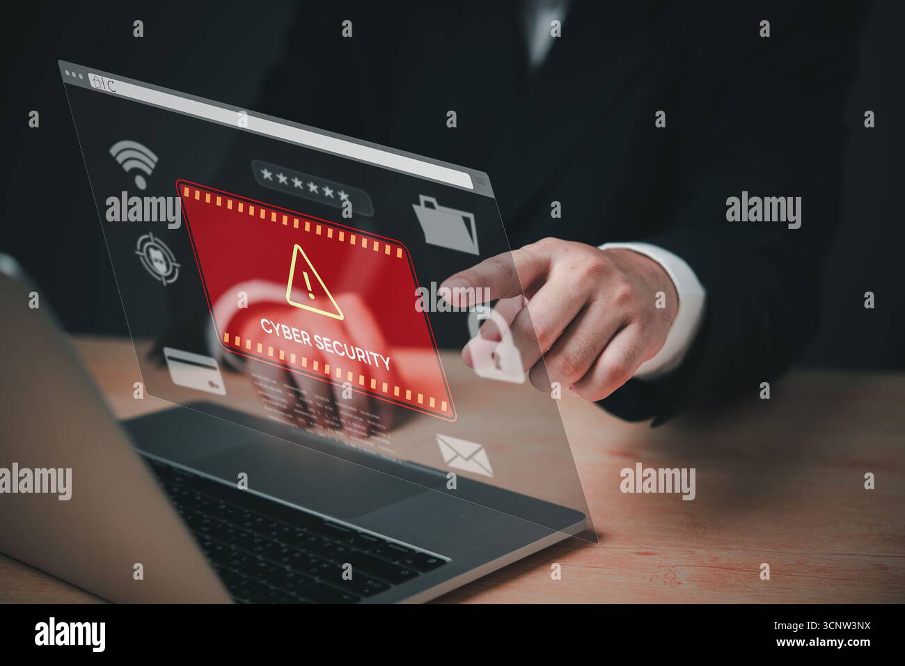 A person is pointing at a computer screen that has a red warning sign that says Cyber Security. The person is wearing a suit and he is in a profession Stock Photo