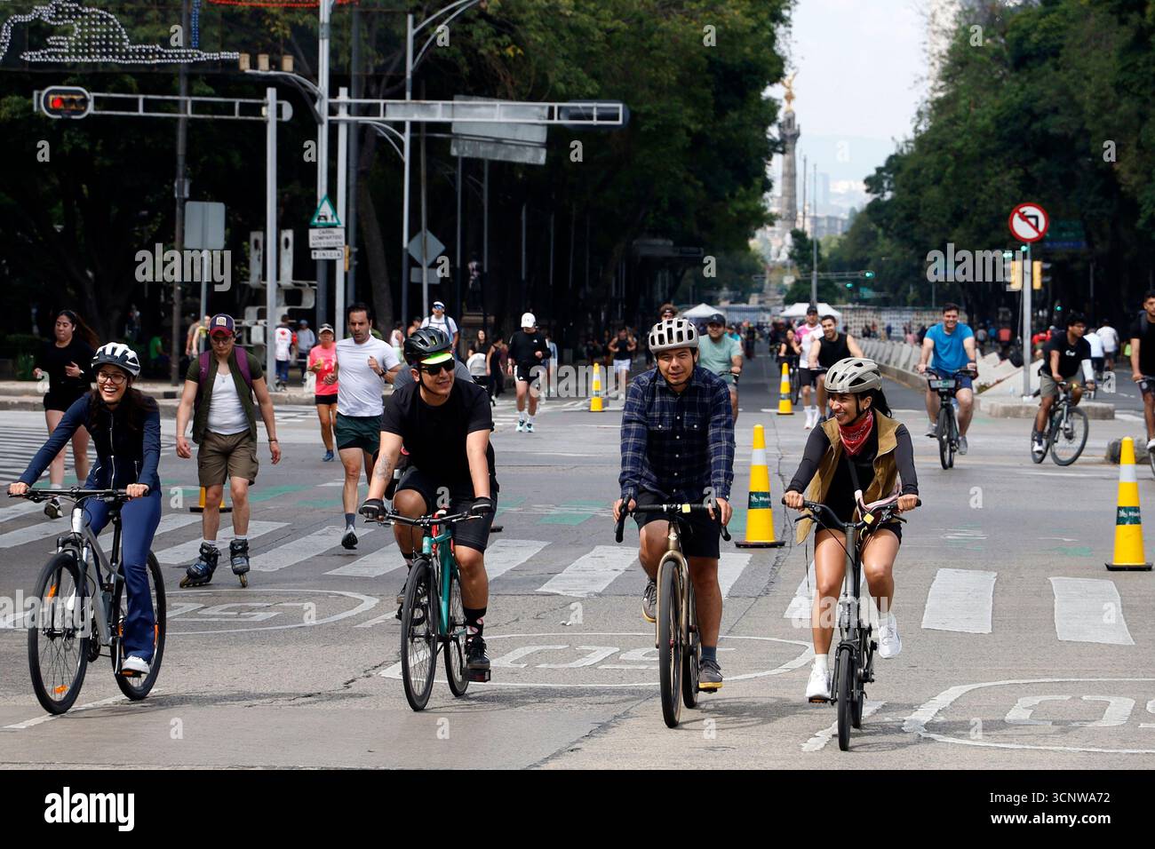 People ride on bicycle taking part during the Sunday Bike Ride 