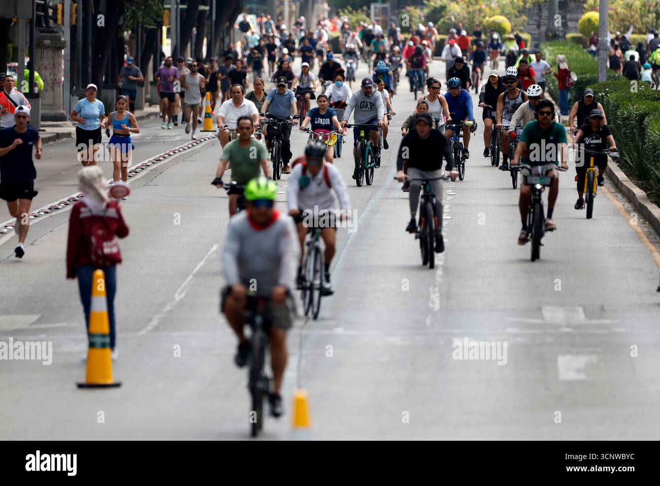 People ride on bicycle taking part during the Sunday Bike Ride 